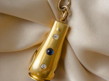 14k Cigarello Cutter with Sapphire Cabachon and Two Old Mine Cut Diamonds For Sale